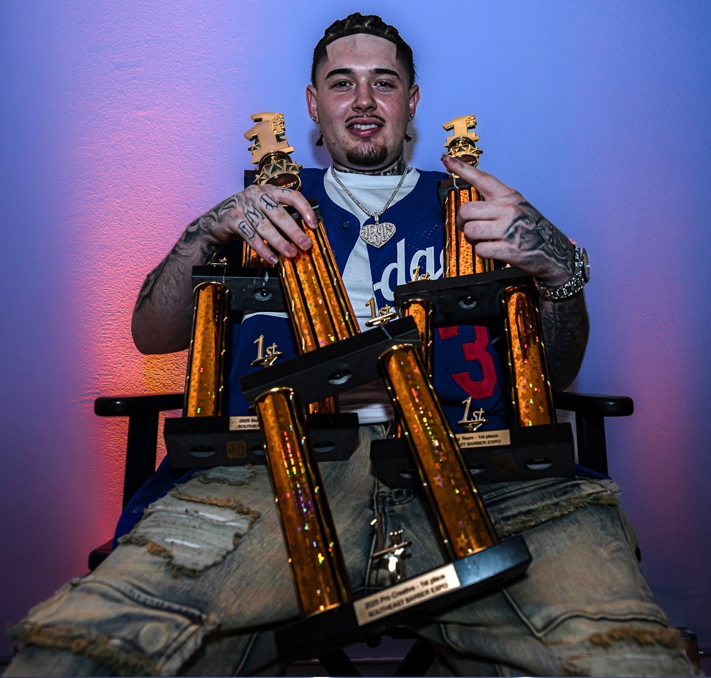 Luciano Delibertis with first-place trophies — Southeast Barber Expo 2025